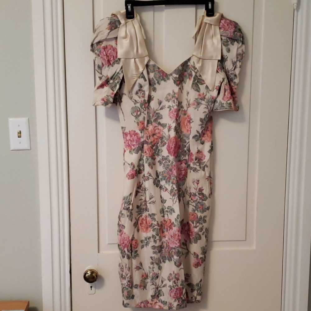 Vintage dress with puff sleeves and bow accents